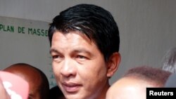 Madagascar presidential candidate Andry Rajoelina leaves the polling center after casting his ballot during the presidential election in Ambatobe, Antananarivo, Madagascar, Dec. 19, 2018.
