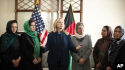 U.S. Secretary of State Hillary Rodham Clinton, center left, meets with Afghan women during a Civil Society roundtable discussion at the U.S. Embassy in Kabul, Afghanistan October 20, 2011.