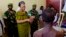FILE - Central African Republic interim President Catherine Samba Panza visits battle victims at the general hospital in Bangui, June 1, 2014. 