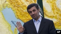 Iranian President Mahmoud Ahmadinejad jokes with journalists in Tehran, March 4, 2012. 