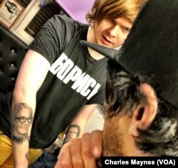 Russian journalist Vitaly Bespalov is seen at a St. Petersburg tattoo parlor in January 2018. Bespalov went undercover in 2014 to report on the Internet Research Agency. Amid attention on the IRA's role in the 2016 US presidential elections, Russian state