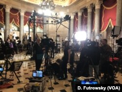 Reporters gather in preparation for interviews after the State of the Union address in Statuary Hall on Capitol Hill in Washington, Jan. 30, 2018.