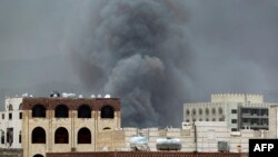 FILE - Smoke billows following an airstrike by the Saudi-led coalition in Sanaa, Yemen, May 27, 2015.