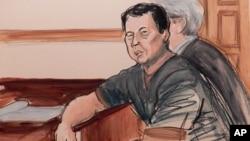 In this courtroom sketch, defendant Ng Lap Seng is seated at the defense table with his attorney during his arraignment on bribery charges in New York, Oct. 6, 2015.