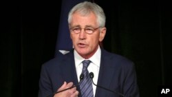 U.S. Secretary of Defense Chuck Hagel speaks during a press conference with Australia's Defense Minister David Johnston in Sydney, Australia, Aug. 11, 2014. 