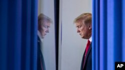 FILE - President Donald Trump arrives to speak about the coronavirus, in the James Brady Press Briefing Room of the White House, in Washington, April 22, 2020. 