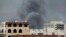 Smoke billows following an airstrike by the Saudi-led coalition on the headquarters of the Special Security Forces, formerly known as the Central Security, in Sana'a, Yemen, May 27, 2015.