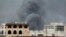 FILE - Smoke billows following an airstrike by the Saudi-led coalition in Sanaa, Yemen, May 27, 2015.