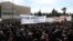 People gather during a protest outside the Greek parliament, in Athens, Greece, March 5, 2023. 