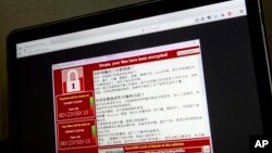Screenshot sebuah monitor komputer di Beijing yang terkena serangan "ransomware", Sabtu 13/5 (foto: ilustrasi). 