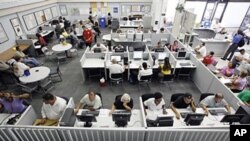 Unemployed people use computers and telephones to search for jobs and seek out unemployment insurance benefits at the Nevada JobConnect Career Center in Las Vegas (Sep 2010 file photo)