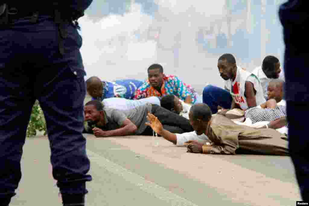 Riot policemen fire teargas canisters to disperse demonstrators during a protest organized by Catholic activists in Kinshasa, Democratic Republic of Congo.