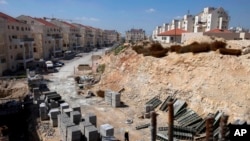 FILE - A general view of a construction site in the West Bank Jewish settlement of Modiin Illit. Israeli rights group B'tselem says it will continue to work to end Jewish settlements in territory Palestinians claim for a future state despite a rebuke by Prime Minister Benjamin Netanyahu.
