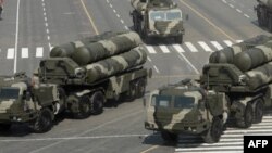 Columns of Russian S-400 Triumf launch vehicles, foreground, Pantsir S1 Air Defense Systems, center, and Iskander mobile ballistic missiles, background left, roll at the Moscow Red Square, Sunday, May 9, 2010, during the Victory Day Parade, which commemor