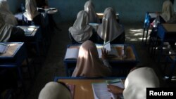 FILE - Afghan girls sit in a classroom at a school in Kabul, Afghanistan, September 18, 2021. (West Asia News Agency via Reuters)