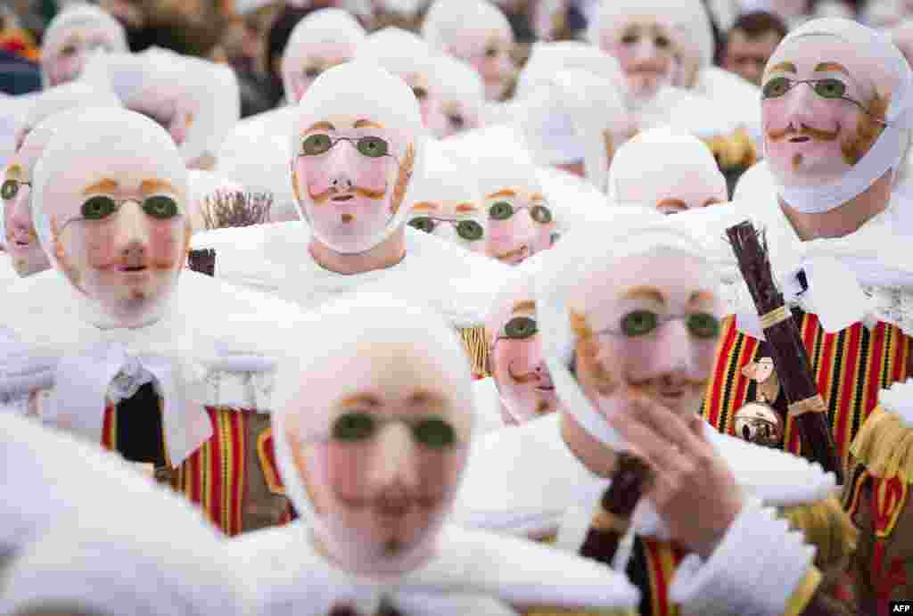 Clown-like performers known as Gilles take part in a carnival parade&nbsp;on Shrove in the streets of Binche, Belgium. The Binche Carnival tradition is one of the most ancient and representative of Wallonia and inscribed in 2008 on the Representative List of the Intangible Cultural Heritage of Humanity by UNESCO.