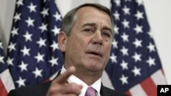 FILE - Outgoing House Speaker John Boehner of Ohio talks with reporters on Capitol Hill in Washington, Oct. 27, 2015.