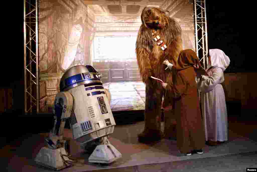 Characters of Star Wars take part in an event held for the release of the film "Star Wars: The Force Awakens" in Disneyland Paris in Marne-la-Vallee, France, Dec. 16, 2015.
