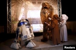 Characters of Star Wars take part in an event held for the release of the film "Star Wars: The Force Awakens" in Disneyland Paris in Marne-la-Vallee, France, December 16, 2015.