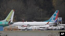 FILE - A Boeing 737-MAX 8 is parked, Nov. 14, 2018, near Boeing Co.'s 737 assembly facility in Renton, Wash.