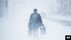 A person walks during a snowstorm in Atlantic City, N.J., Jan. 4, 2018.