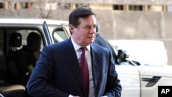 FILE - Former Trump campaign chairman Paul Manafort arrives at federal court in Washington, Monday, Dec. 11, 2017. 
