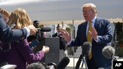 President Donald Trump speaks to reporters on the South Lawn of the White House in Washington, June 22, 2019, before boarding Marine One for the trip to Camp David in Maryland. 