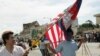 FILE PHOTO - Cambodian Student Society members Sraiph Phan, 21, left, and Danny Sre, 16, march during the Cambodian New Year's Parade in Long Beach Calif., on Sunday, April 24, 2005.