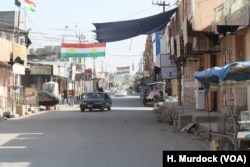 Tuz Khurmatu streets are empty after a night of fighting and some families are already fleeing the violence on Oct. 14, 2017, in Tuz Khurmatu, Iraq.