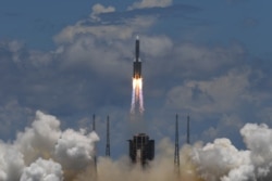 A Long March-5 rocket, carrying an orbiter, lander and rover as part of the Tianwen-1 mission to Mars, lifts off from the Wenchang Space Launch Centre in southern China's Hainan Province on July 23, 2020.