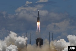 A long March 5 rocket with an orbit, lander and rover as part of the Tianwen-1 mission to Mars, departs from the Wenchang Space Launch Center in Hainan Province in southern China.  on July 23, 2020.