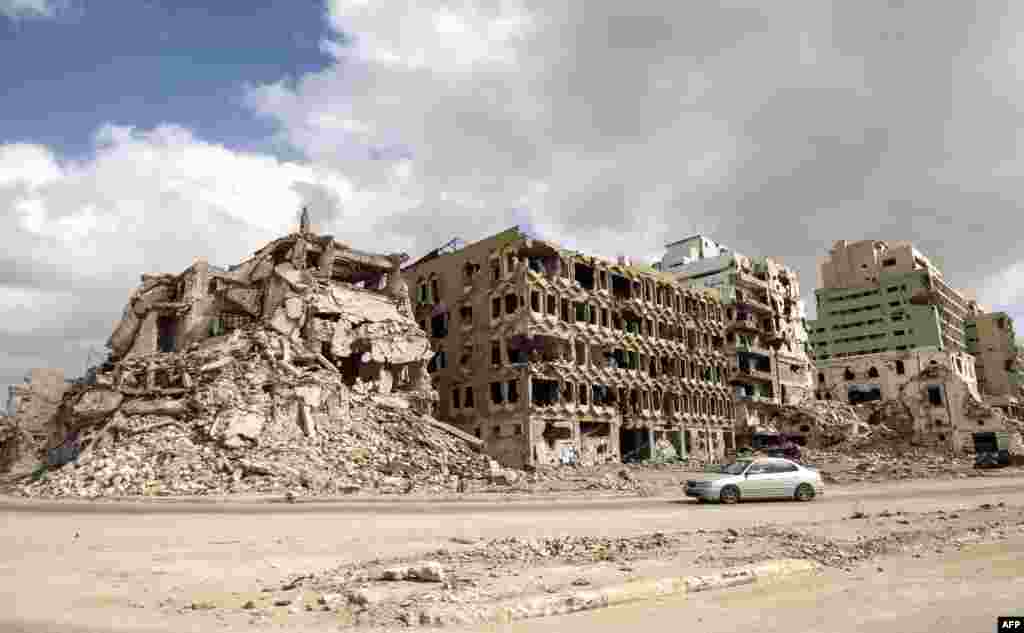 Destroyed buildings are seen along the seaside promenade of Libya&#39;s eastern city of Benghazi.