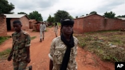 FILE - Seleka rebels walk through the town of Bria, Central African Republic, July 15, 2013. Recent fighting between rival militia groups, some in Bria, has killed 16 people, U.N. peacekeepers said Wednesday, Nov. 23, 2016.