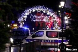 FILE - Police secures area where a suspect is sought after a shooting in Strasbourg, France, Dec. 11, 2018.