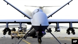 Fully armed MQ-9 Reaper unmanned aerial vehicle taxis down the runway (file photo)
