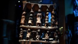 FILE - A royal seat of the 'Royal treasures of Abomey kingdom' (Œuvres des tresors royaux d’Abomey) on display at the Musee du quai Branly in Paris, Sept. 10, 2021.