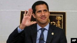 Juan Guaido, President of National Assembly and self-proclaimed interim president waves to the gallery during a session of the National Assembly in Caracas, Venezuela, April 2, 2019. 