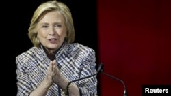 Democratic presidential candidate Hillary Clinton gestures before delivering the keynote address at the Women in the World summit in New York, April 23, 2015. 
