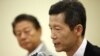 Kim Young-hwan (R) a pro-North Korean activist speaks at a news conference in Seoul, July 25, 2012.
