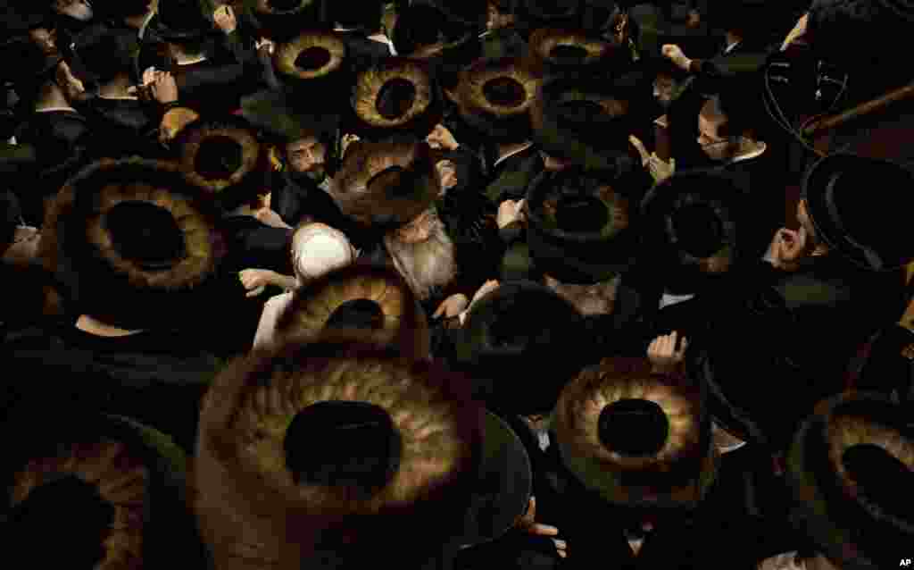 Ultra-Orthodox Jewish men gather at a yeshiva, a rabbinical seminary, during Purim celebrations in Jerusalem, Feb. 25, 2013.