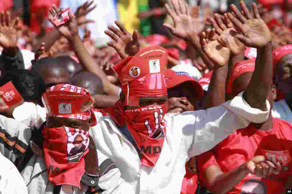 Movement For Democratic Change (MDC) supporters chant the partys slogan as MDC President Morgan Tsvangirai addresses thousands of party supporters at his last campaign rally before elections set for July 31, in Harare.