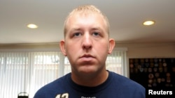 FILE - Darren Wilson, who resigned from the Ferguson Police Department, is pictured in an undated handout photo.
