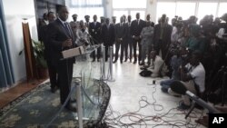 FILE - Senegalese President Macky Sall, front left, responds to journalists' questions during a press conference. 