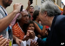 Organization of American States Secretary-General Luis Almagro greets Venezuelan migrants in La Parada, Colombia, Sept. 14, 2018. Almagro traveled to the Colombia's border with Venezuela to monitor the situation of migrants who have been fleeing the socialist-run country amid hyperinflation and widespread shortages and widespread shortages.