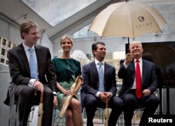 FILE - Donald Trump, right, along with his children, from left, Eric, Ivanka and Donald Jr. attend a ceremony announcing a new hotel and condominium complex in Vancouver, British Columbia June 19, 2013.