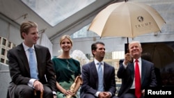 Donald Trump along with his children, from left, Eric, Ivanka and Donald Jr. attend a ceremony announcing a new hotel and condominium complex in Vancouver, British Columbia, June 19, 2013.
