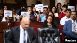 Immigrant supporters protest during a Los Angeles City Council ad hoc committee on immigration meeting to discuss the city's response to threats by the Trump administration to cut funding from Los Angeles and other jurisdictions that federal officials say are providing sanctuary to illegal immigrants arrested for crimes, March 30, 2017.