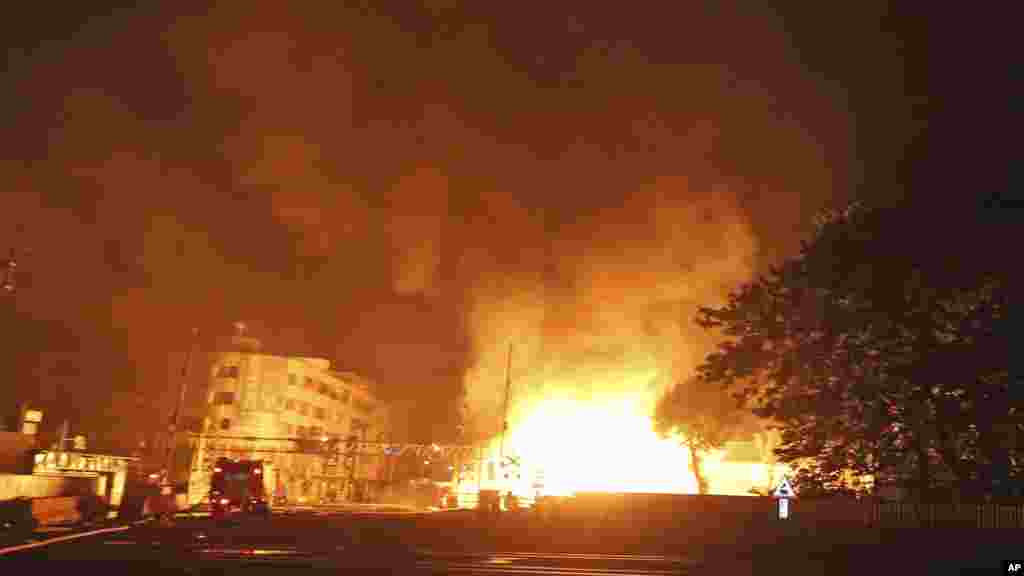 Flames from an explosion from an underground gas leak in the streets of Kaohsiung, Taiwan, Aug. 1, 2014.