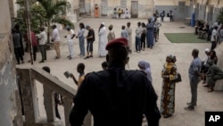 People wait to vote in legislative elections in Dakar, Senegal, Nov. 17, 2024. The ruling party, PASTEF, won a solid victory, taking 130 of 165 seats, according to provisional results announced Nov. 21. 