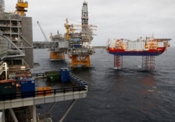 FILE - Equinor's Johan Sverdrup oilfield platforms and accommodation jack-up rig Haven are pictured in the North Sea, Norway, Dec. 3, 2019.